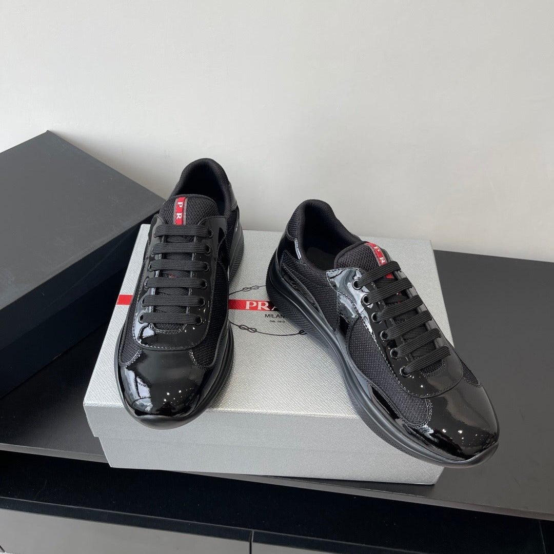 PRADA SNEAKER 25S IN BLACK MESH AND PATENT CALFSKIN