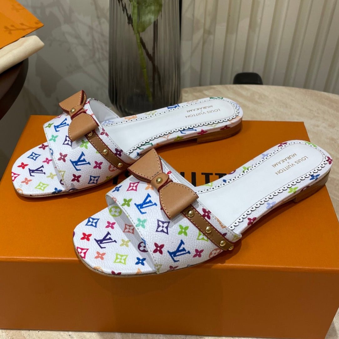 FLAT MULES IN WHITE MONOGRAM LAMBSKIN